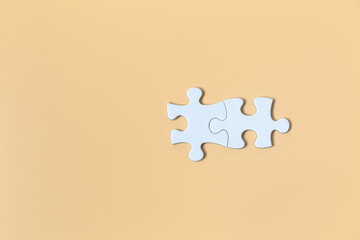 piece of  White jigsaw puzzle On the Yellow background . teamwork concept.  symbol of association and connection. business strategy.