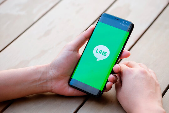 February 11, 2018 Bangkok, Thailand Women use mobile internet application line on smartphone. line is social networking service.She surf the Internet to get information of the world.