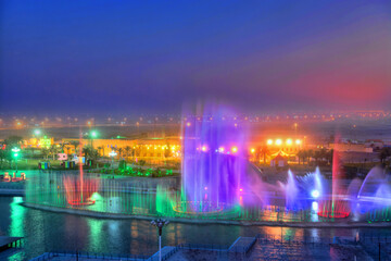Fototapeta na wymiar Dancing fountain with beautiful view with charming lighting colors