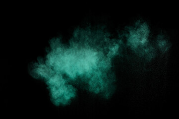 Aquamarine powder explosion on black background. Colored powder cloud. Colorful dust explode. Paint  Holi.