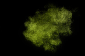 Light green powder explosion on black background. Colored powder cloud. Colorful dust explode. Paint  Holi.