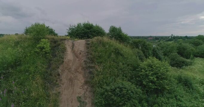 Russian landscape. Beautiful views of an ancient mound on the Bank of the Volkhov river, taken from a quadcopter on a summer day. According to legend, this hill is the grave of the "prophetic" Oleg, R