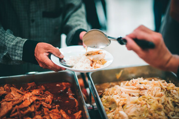 The concept of human hunger : Volunteers donate free charity food to the homeless