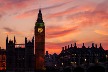 Fototapeta na wymiar A beautiful fiery sunset silhouettes Big Ben and the London Skyline.