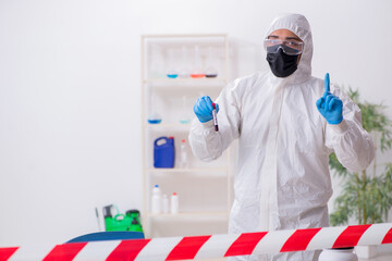 Young male chemist working in medicine lab