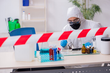 Young male chemist working in medicine lab