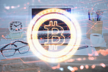 Double exposure of blockchain and crypto economy theme hologram and table with computer background....