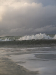 Waves breaking off the coast of a small rural town, New Zealand. 
