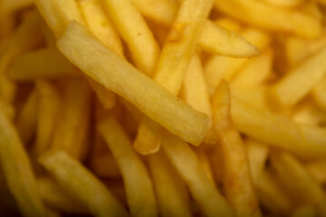 French fries on a plate Close-up. Surface texture.