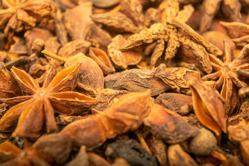 Star anise is the surface texture. Close up.