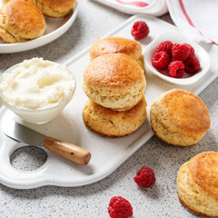Scones with raspberry jam and clotted cream.