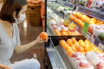 Asian woman wearing medical mask shopping