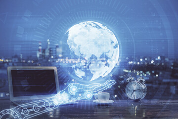 Fototapeta premium Multi exposure of table with computer and world map hologram. International data network concept.