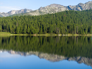 Lake in the wild. Coniferous forests of Siberia. Ergaki Nature Park