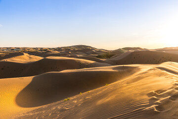 Fototapeta na wymiar Sunset view of Sand dunes in XiangshaWan, or Singing sand Bay, in hobq or kubuqi desert, Inner Mongolia, China