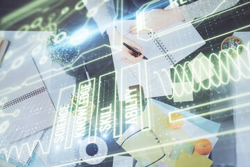 Education theme hologram over woman's hands writing background. Concept of study. Double exposure