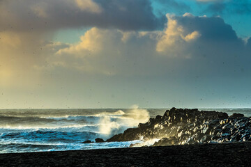 A stone jetty at sunrise in Vik, Iceland