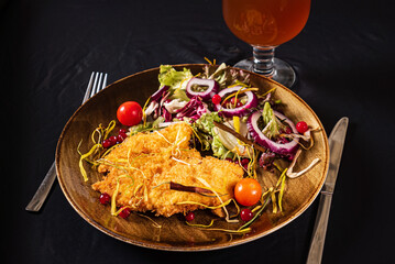 schnitzel with salad and beer