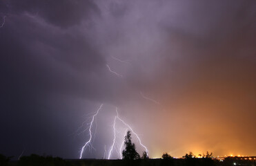 lightning bolts in the night sky during a thunderstorm

