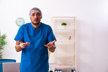 Young male doctor surgeon in fatal negligence concept