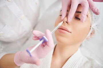 Obraz na płótnie Canvas Non surgical beauty therapy in professional cosmetology salon