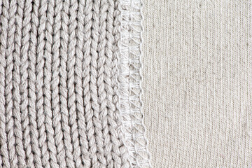 White knitting wool with stitches texture background.