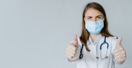 Doctor Wearing Medical face Mask and Gloves Isolated thumbs up. Preventives mers against virus concept. Banner with copy space for your text.