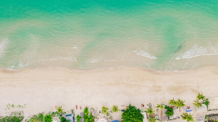 Top View, Wave of Turquoise ocean water on sandy beach, High angle view sea and sand background, Aerial top view of Khanom beach, Khanom, Nakhon Si Thammarat Thailand