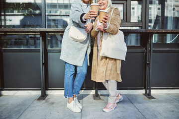 Happy ladies enjoying good warm wether in the street town