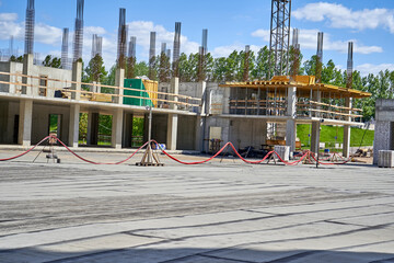 Pillars in construction site with crane