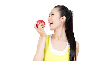 Young Asian woman eating apple after exercise in the gym