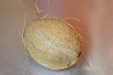 light coconut on metallic silver gray shiny background