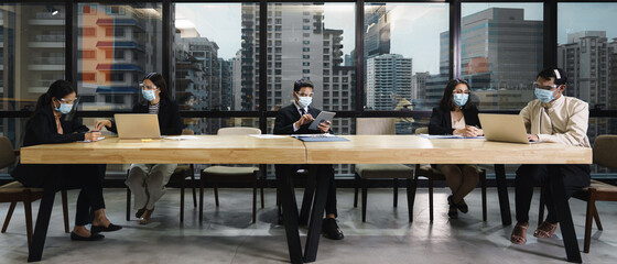 new normal practise businesspeople wear mask and keep social distance