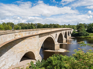 Fototapeta na wymiar Coldstream bridge linking Coldstream to Northumberland, UK