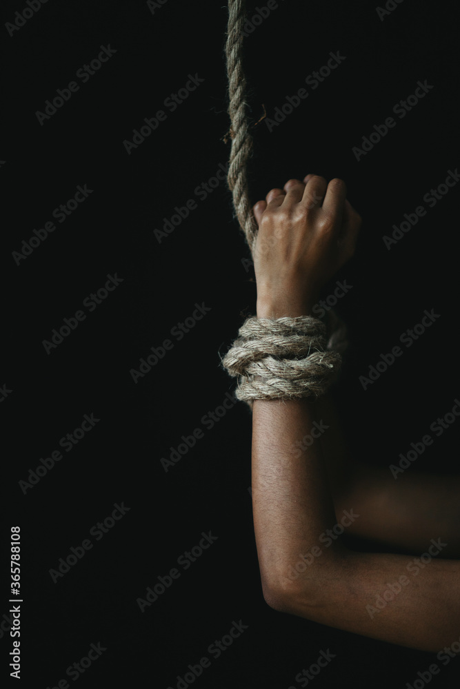 Wall mural hands tied with rope