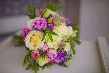 Closeup view wedding bouquet of flowers from freshly cut roses and other beautiful flowers in the composition