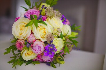 Wedding bouquet of flowers from freshly cut roses and other beautiful flowers in the composition
