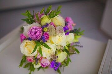 Wedding bouquet of flowers from freshly cut roses and other beautiful flowers in the composition