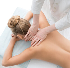 Obraz na płótnie Canvas Nude blonde being massaged top view