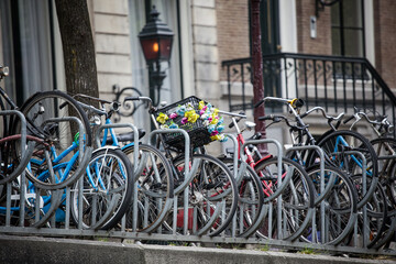 many parked bicycles on the street of Amsterdam