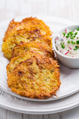 Fried potato pancake with dip of radishes cream cheese and chives