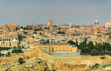 Fototapeta na wymiar Panoramically view over old city of Jerusalem with streets full of vehicles in Jerusalem, Israel.