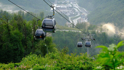 Aerial panoramic view of the Rosa Khutor. Cable Car mountain on a sunny day with blue sky and...