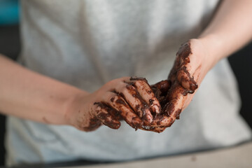 young woman making truffles candy on kitchen