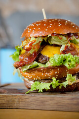 Cheeseburger on a wooden cut board