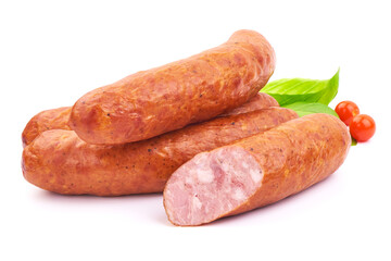 Delicious Smoked Sliced Sausages with Basil leaves, isolated on a white background. Close-up.