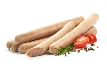 Raw Nuremberg Sausages with herbs, pepper and tomatoes, isolated on a white background. Close-up.