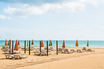 Empty deck chairs at beach during quarantine times