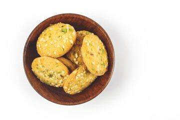 Home made sweet biscuits with mixed nuts in wooden bowl
