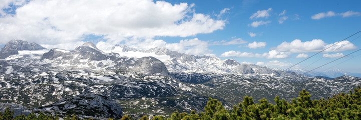 Obraz premium Panoramic mountain landscape with high alpine peaks. Dachstein. Austria
